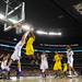 Michigan freshman Glenn Robinson III reaches for the ball over Kansas senior Jeff Withey during the first half at Cowboys Stadium in Arlington, Texas on March 29, 2013. Melanie Maxwell I AnnArbor.com